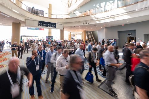 Attendees enter the GlassBuild show floor on day 2 in Orlando