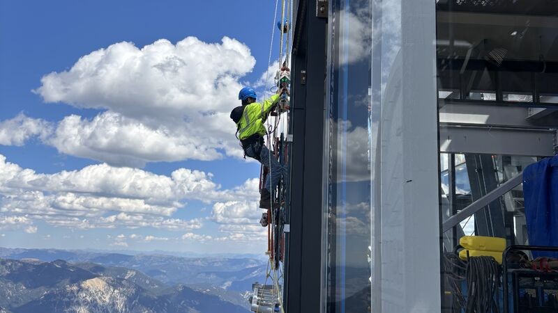 glass installer working in scenic location