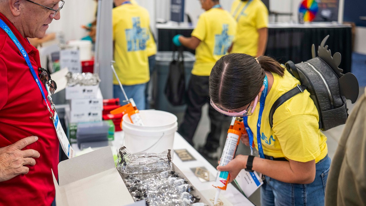 Students try installation tasks during GlassBuild America