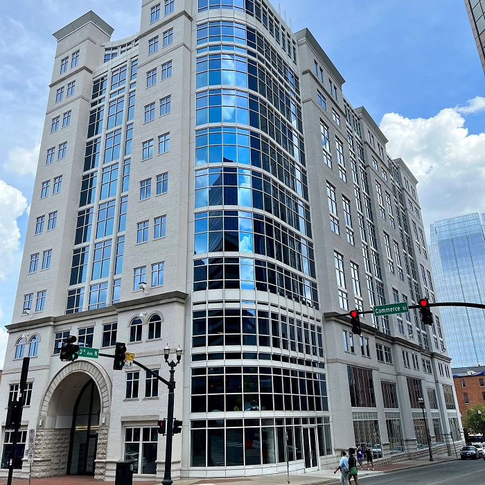 older building with bent glass wall