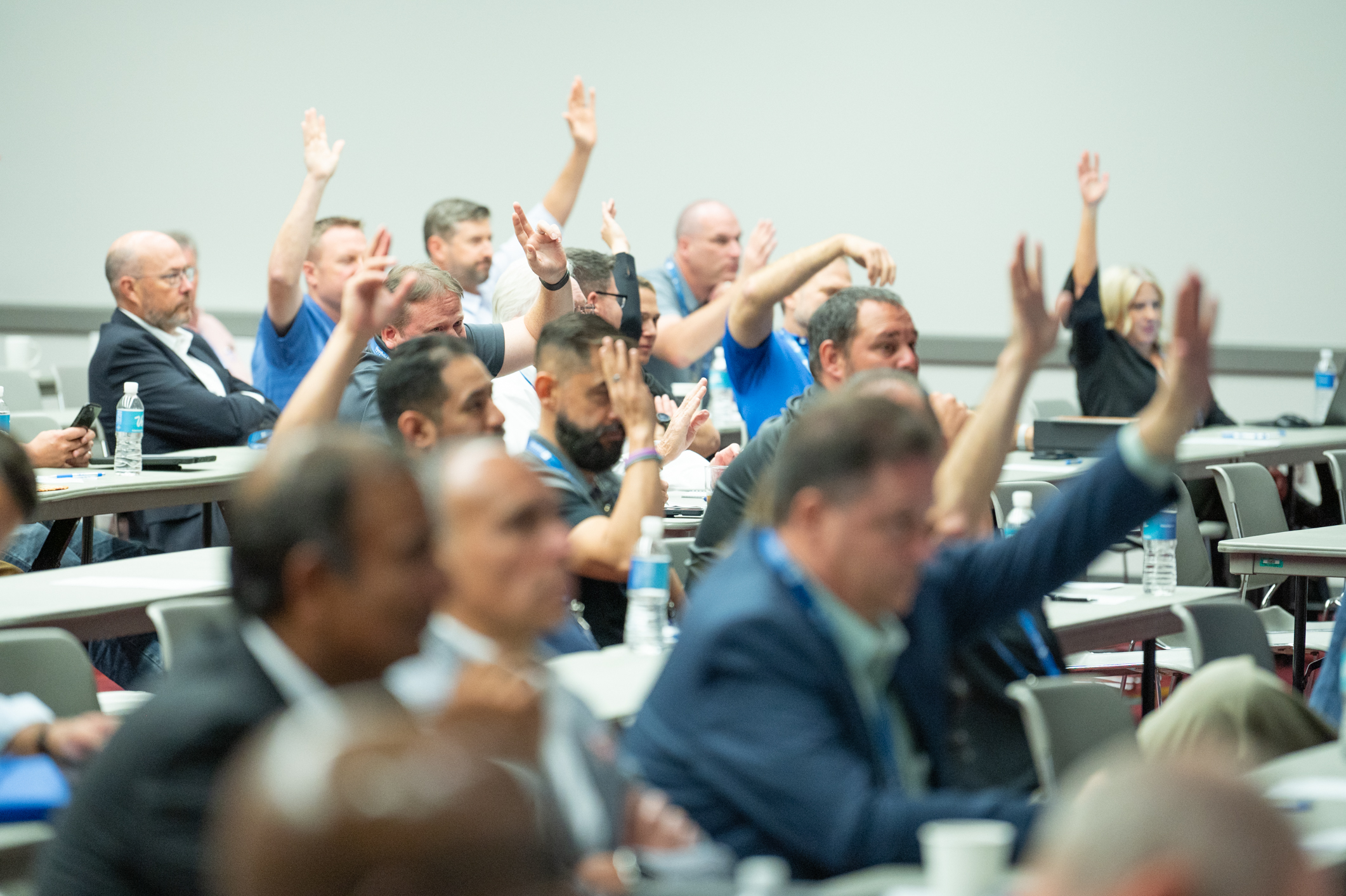 audience with hands up at Glazing Executives Forum