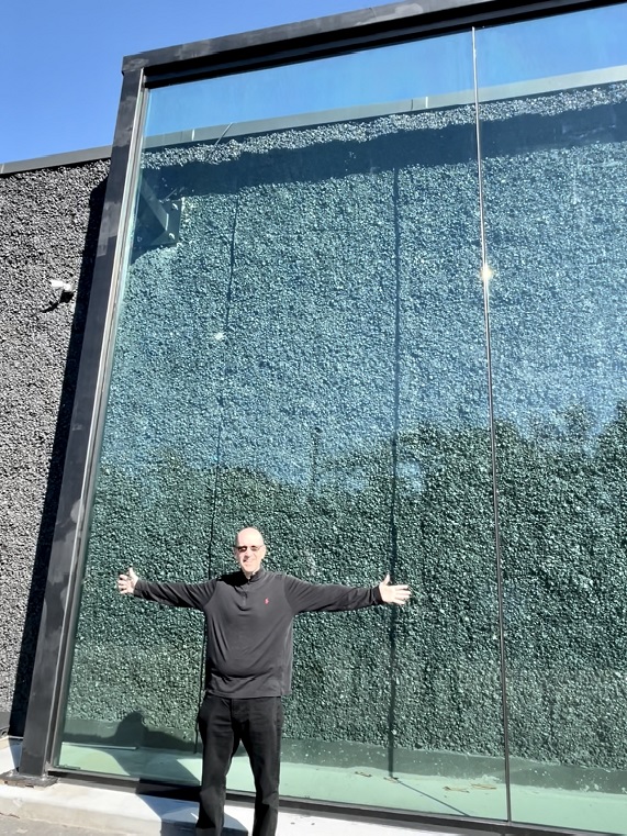 Jumbo glass several times the height of person