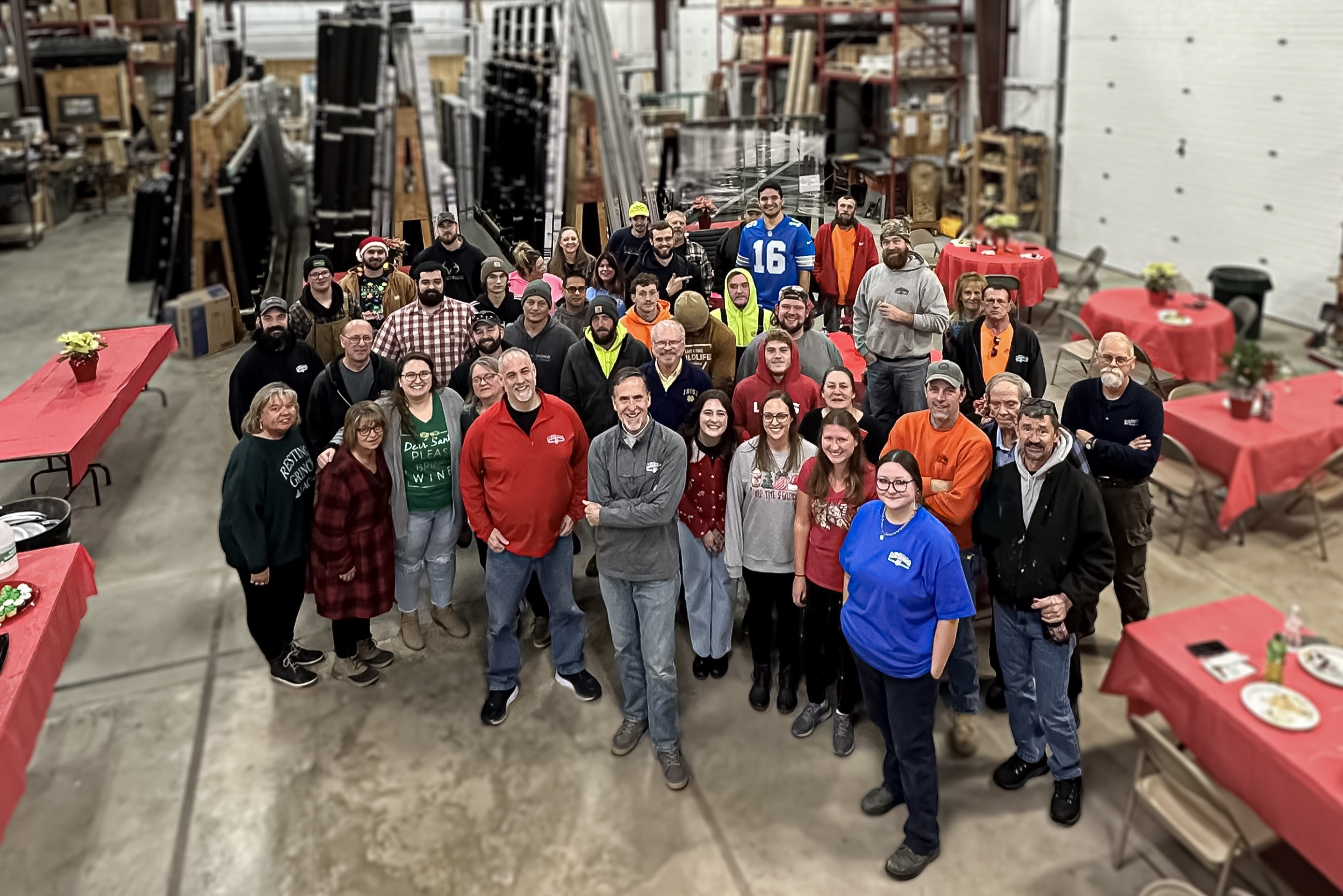 Midwest Glass & Mirror employees gather on the floor