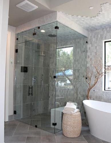 floor to ceiling glass shower enclosure in new bathroom