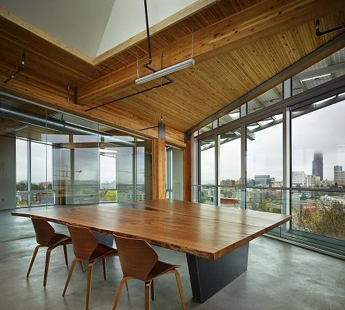 interior of an office building looking through floor-to-ceiling windows