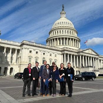 Advocacy Days attendees stand in front of the Capitol