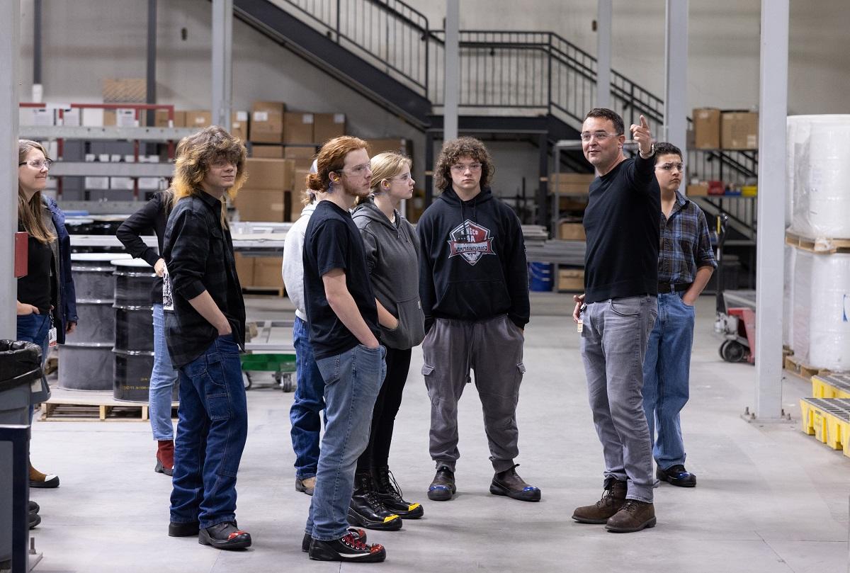 students listen to a tour guide
