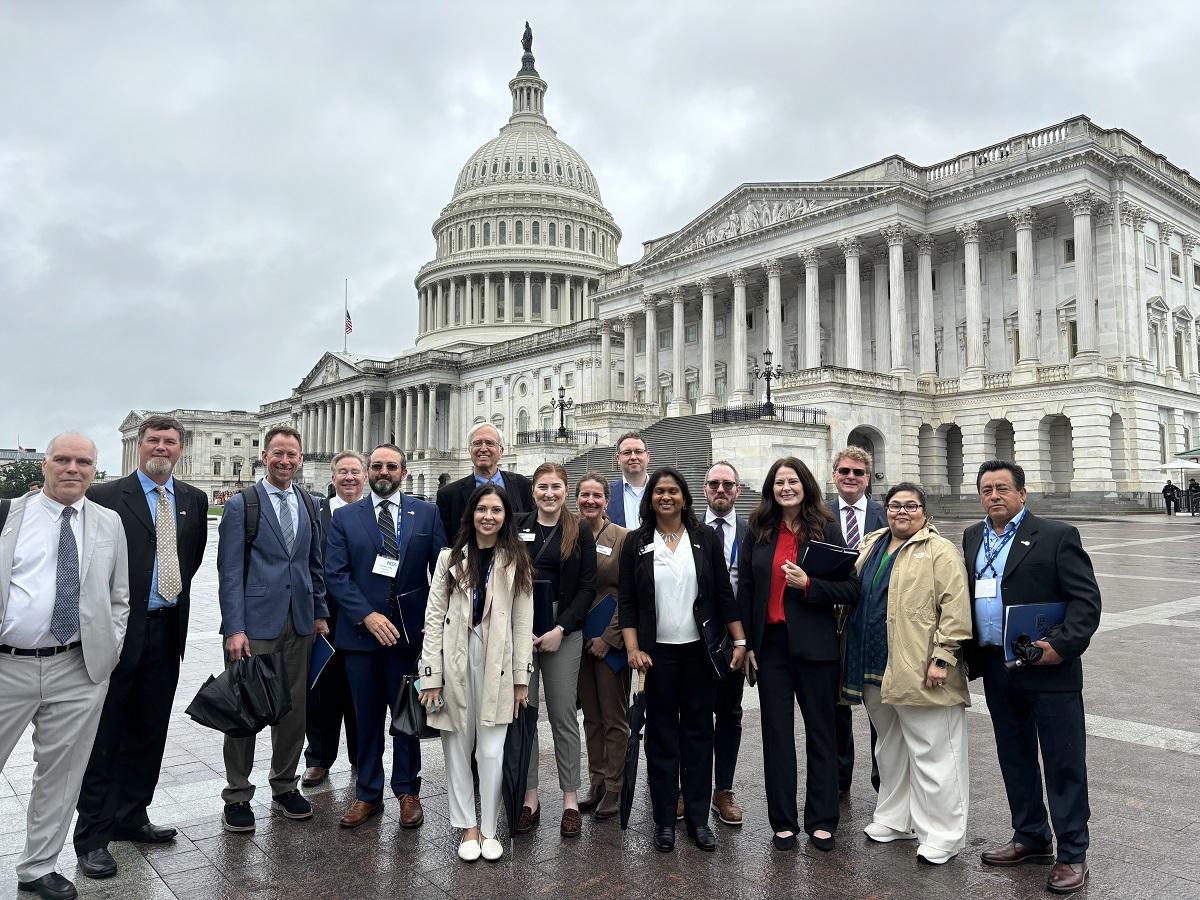 Advocacy Days attendees stand in front of the US Capitol